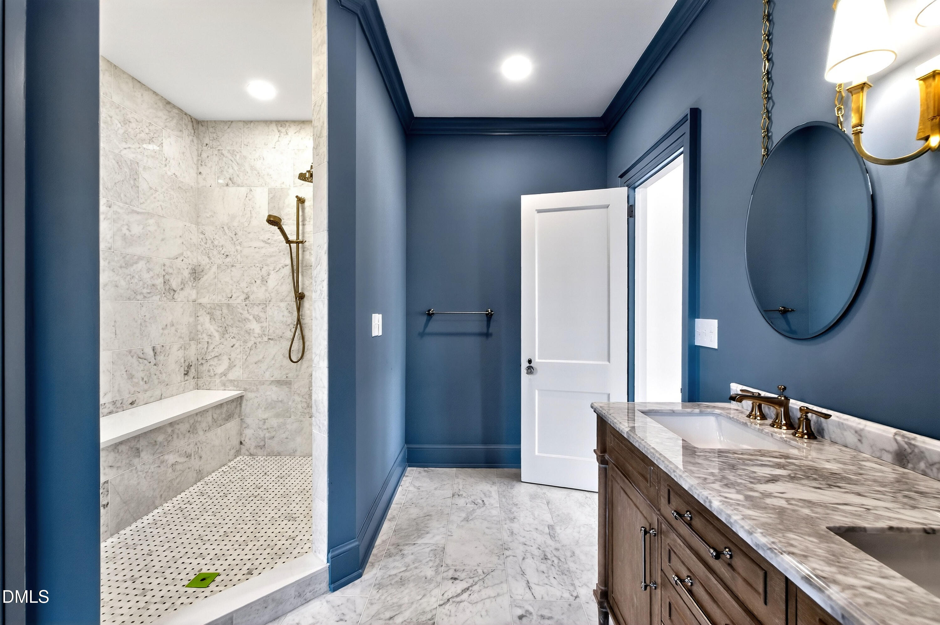 1313 College Place Raleigh, NC 27605 - Photo 5 of 71 a bathroom with a granite countertop sink a mirror and a shower
