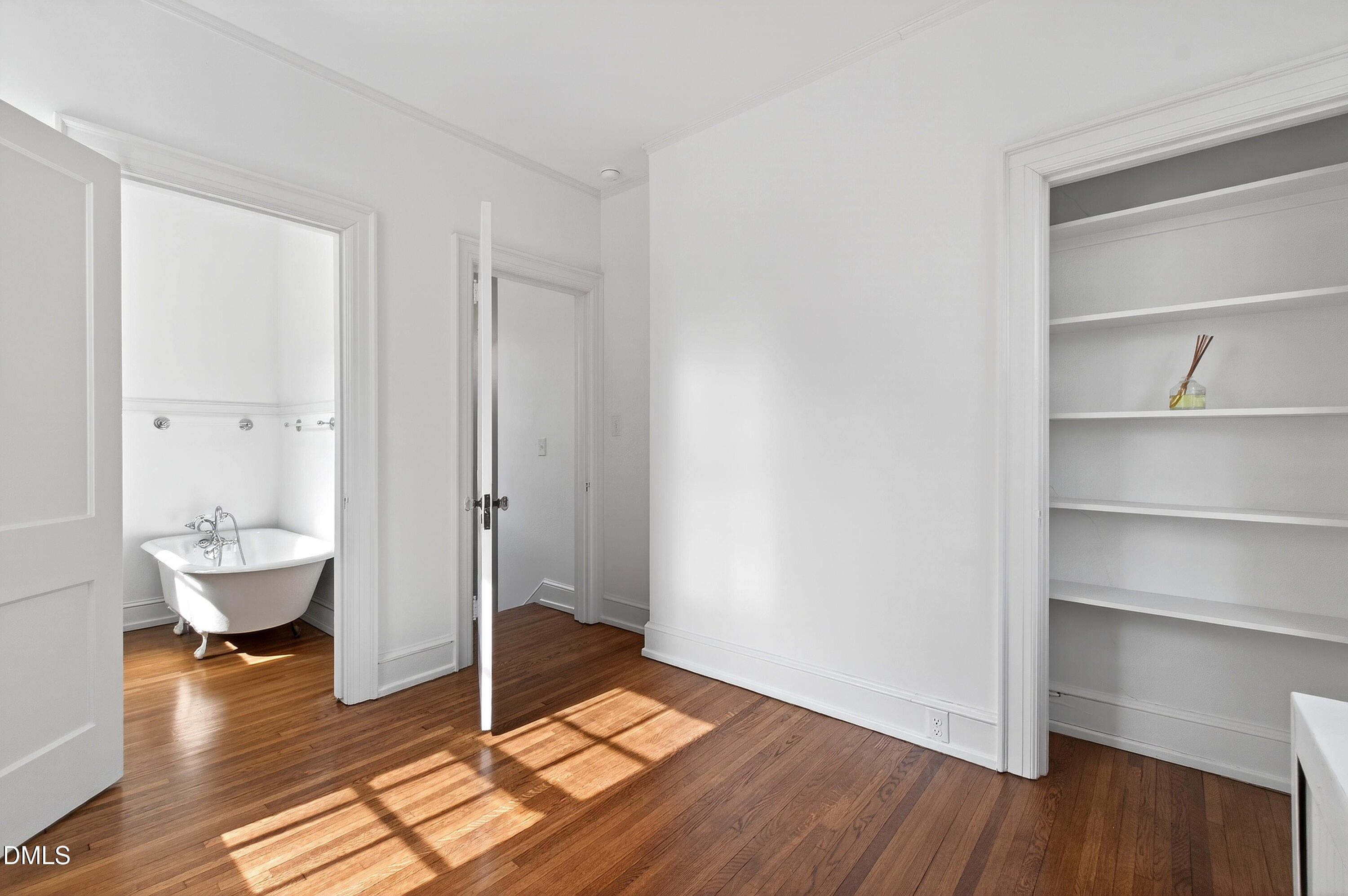 1313 College Place Raleigh, NC 27605 - Photo 53 of 71 a view of empty room with wooden floor and bathroom