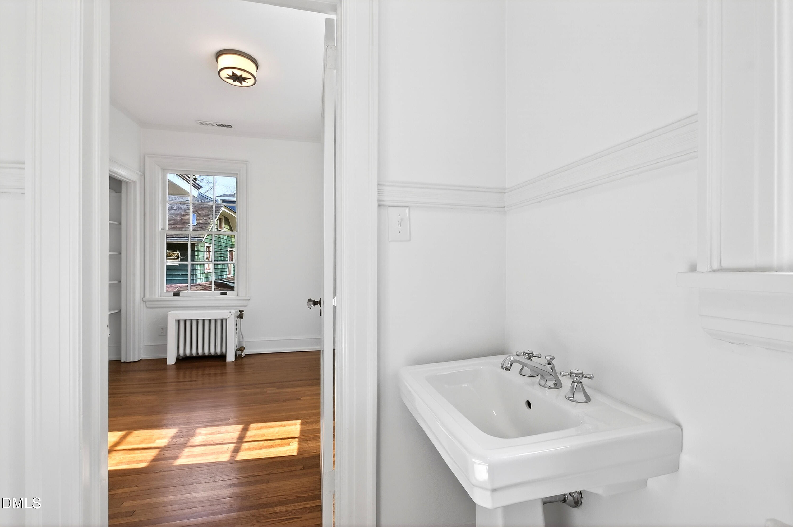 1313 College Place Raleigh, NC 27605 - Photo 54 of 71 a bathroom with a sink and a bathtub