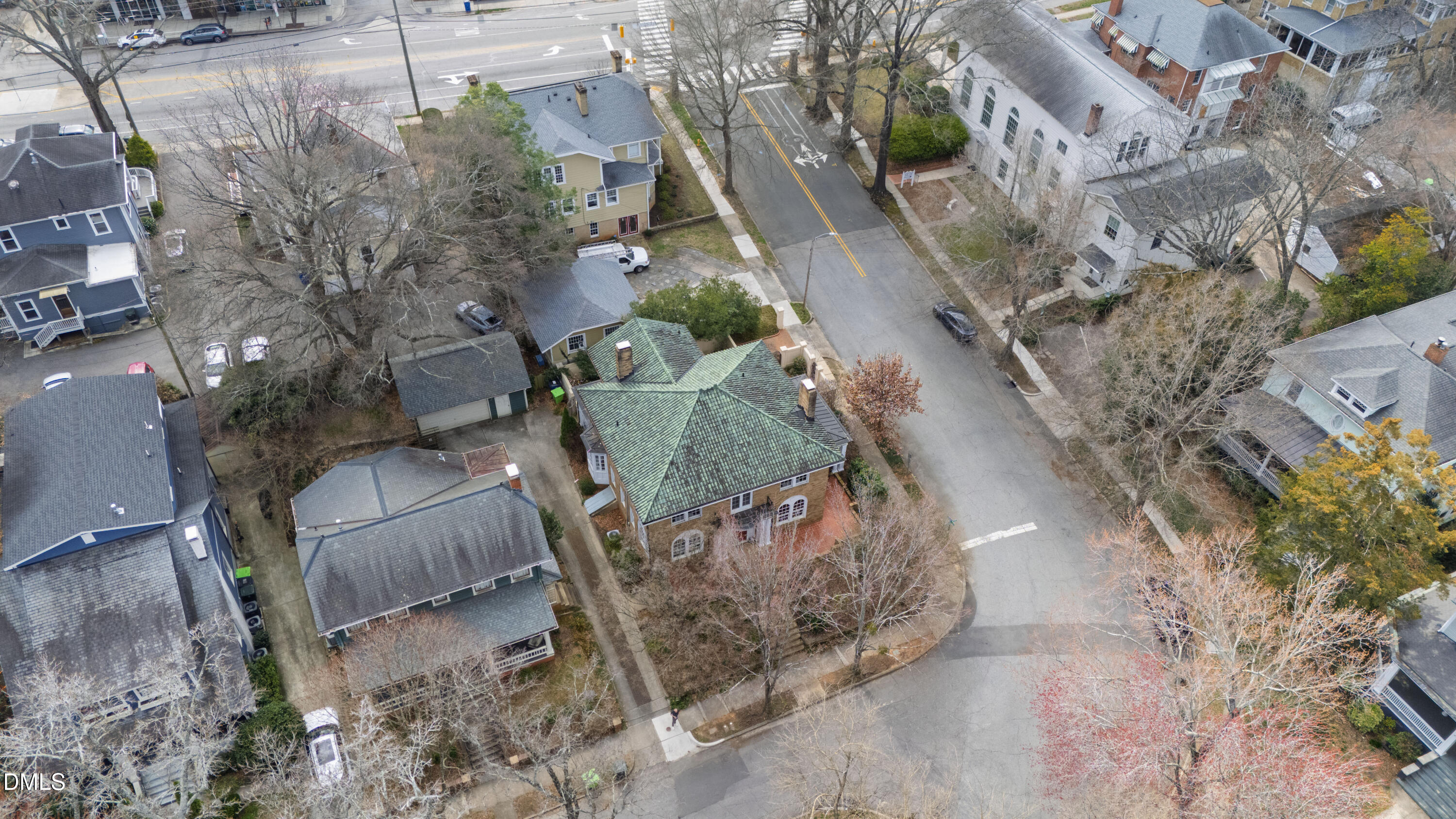 1313 College Place Raleigh, NC 27605 - Photo 63 of 71 an aerial view of a house with a yard and lake view