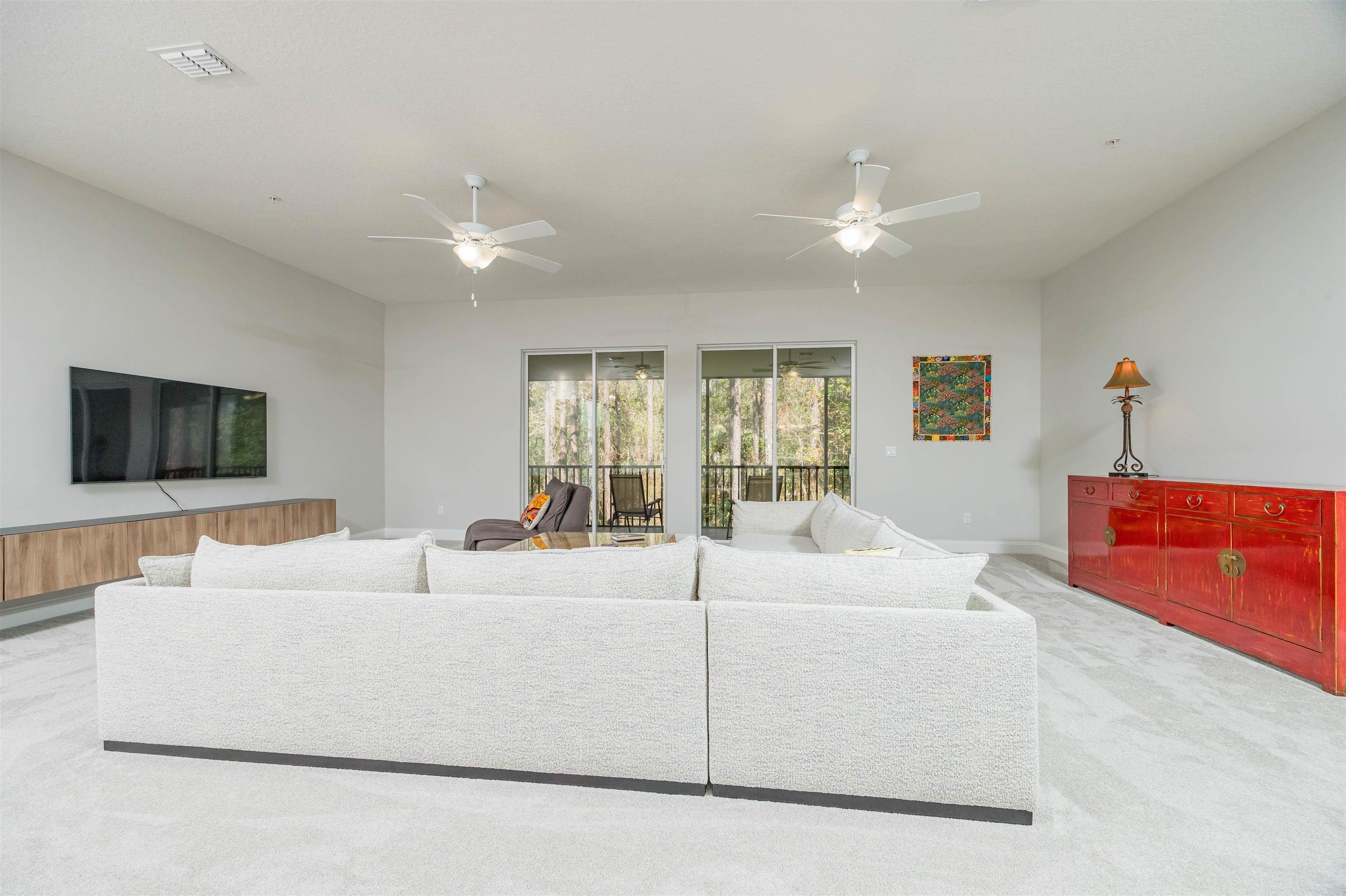 111 CanyonTrail St. Augustine, FL 32086 - Photo 25 of 55 a living room with furniture and a flat screen tv