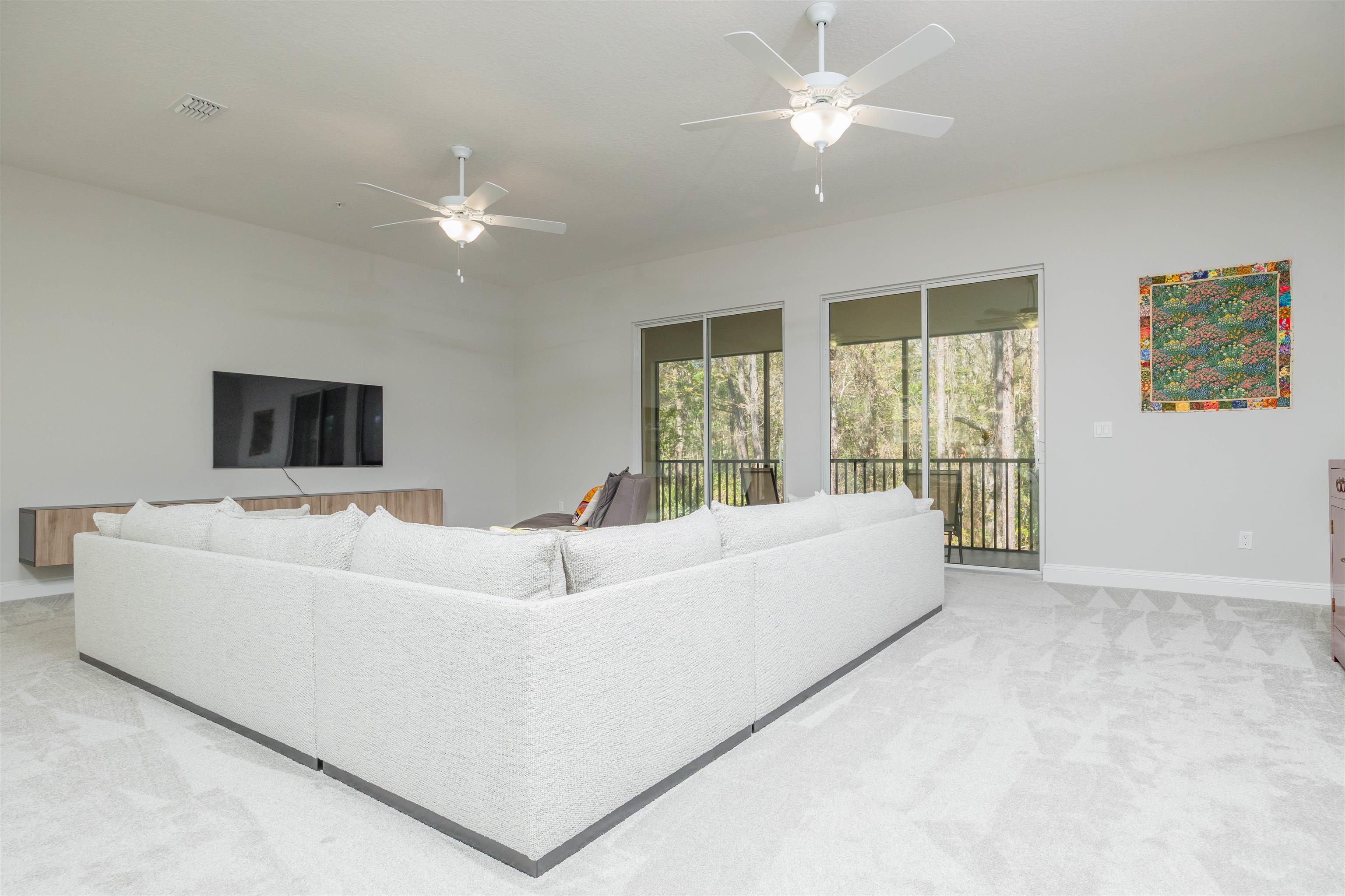 111 CanyonTrail St. Augustine, FL 32086 - Photo 28 of 55 a living room with furniture and a large window