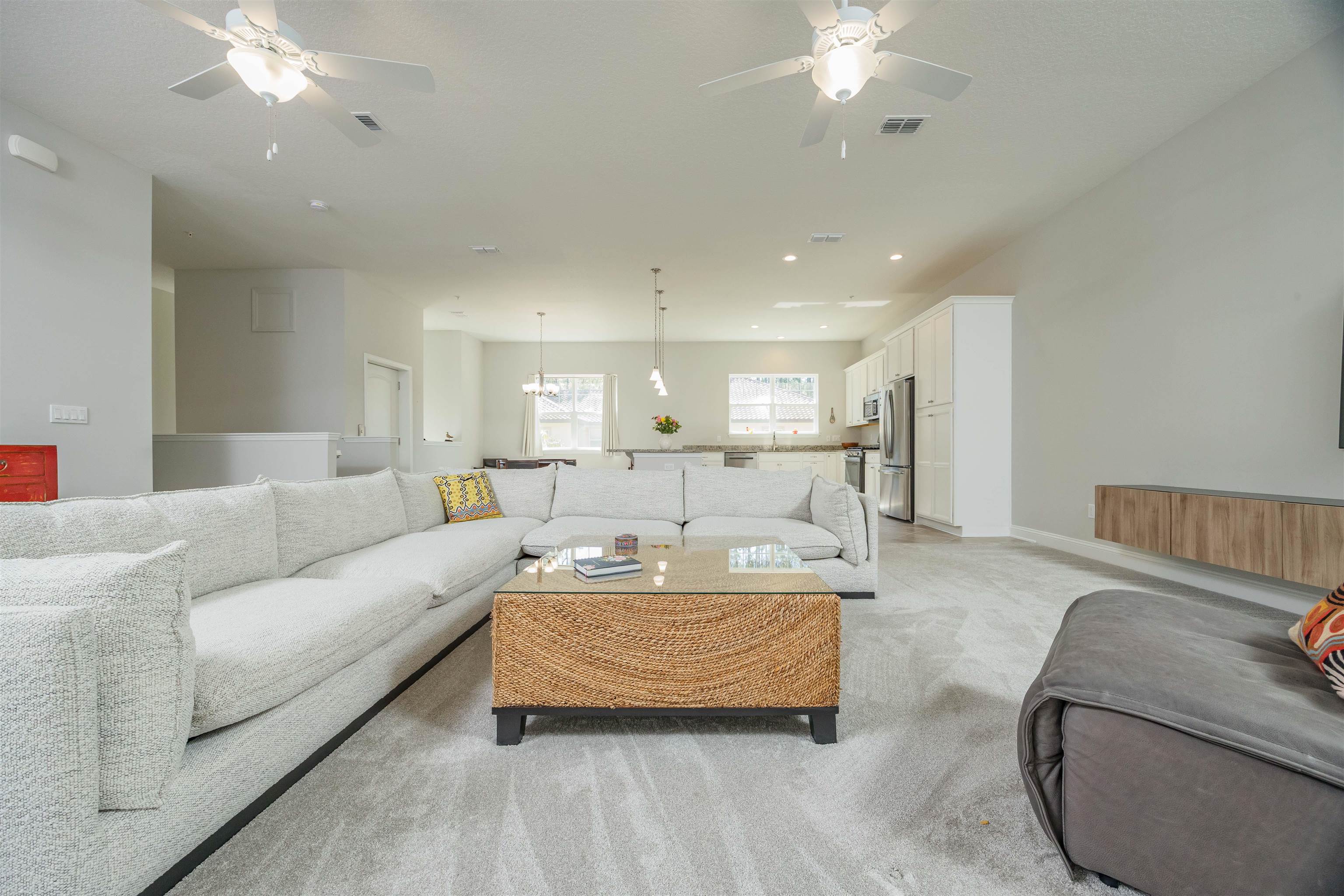 111 CanyonTrail St. Augustine, FL 32086 - Photo 29 of 55 a living room with furniture and a chandelier