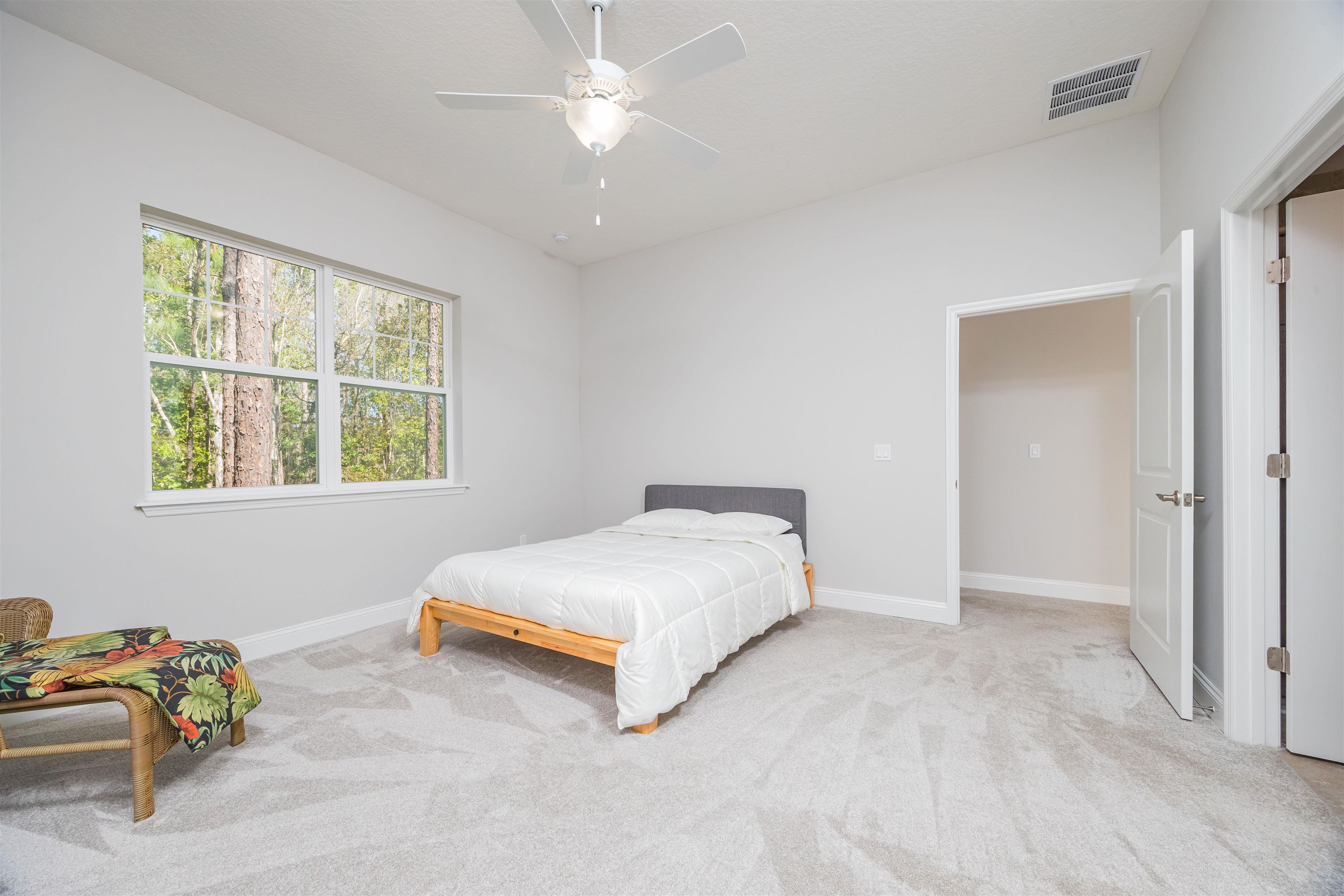 111 CanyonTrail St. Augustine, FL 32086 - Photo 33 of 55 a spacious bedroom with a bed and a window