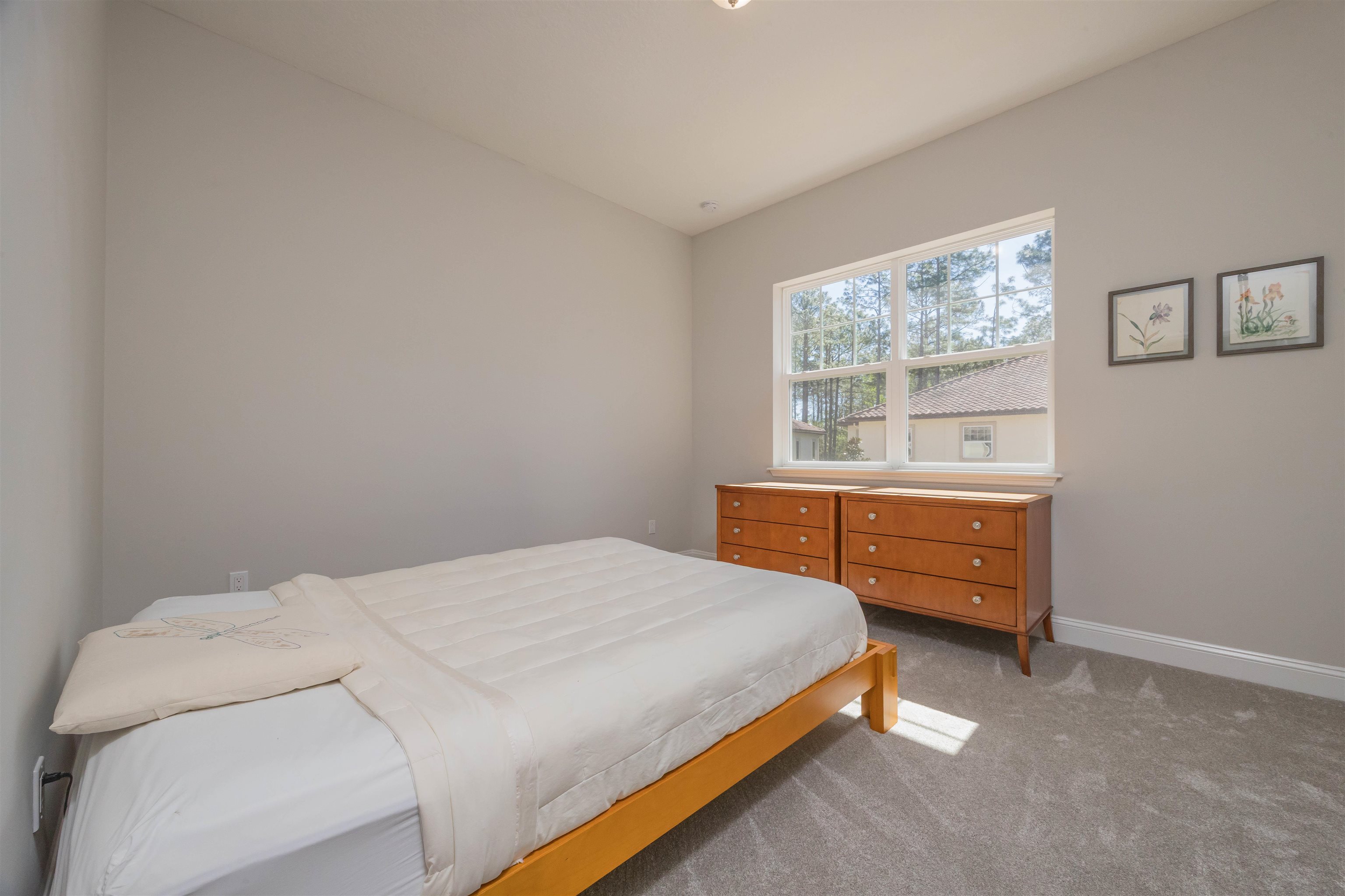 111 CanyonTrail St. Augustine, FL 32086 - Photo 44 of 55 a bedroom with a bed and a window