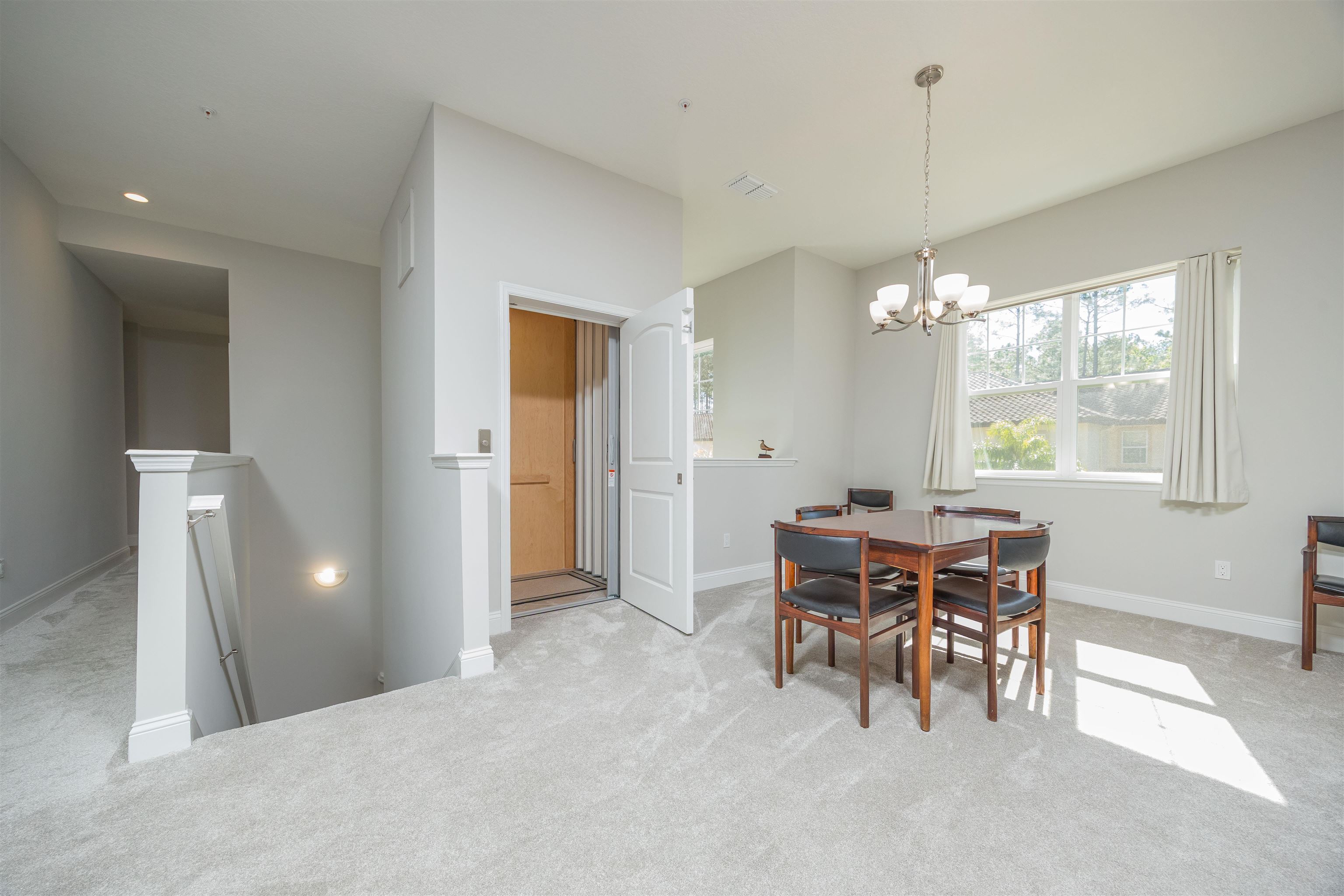 111 CanyonTrail St. Augustine, FL 32086 - Photo 10 of 55 a view of a dining room with furniture and chandelier
