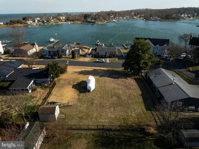 an aerial view of a house with a lake view