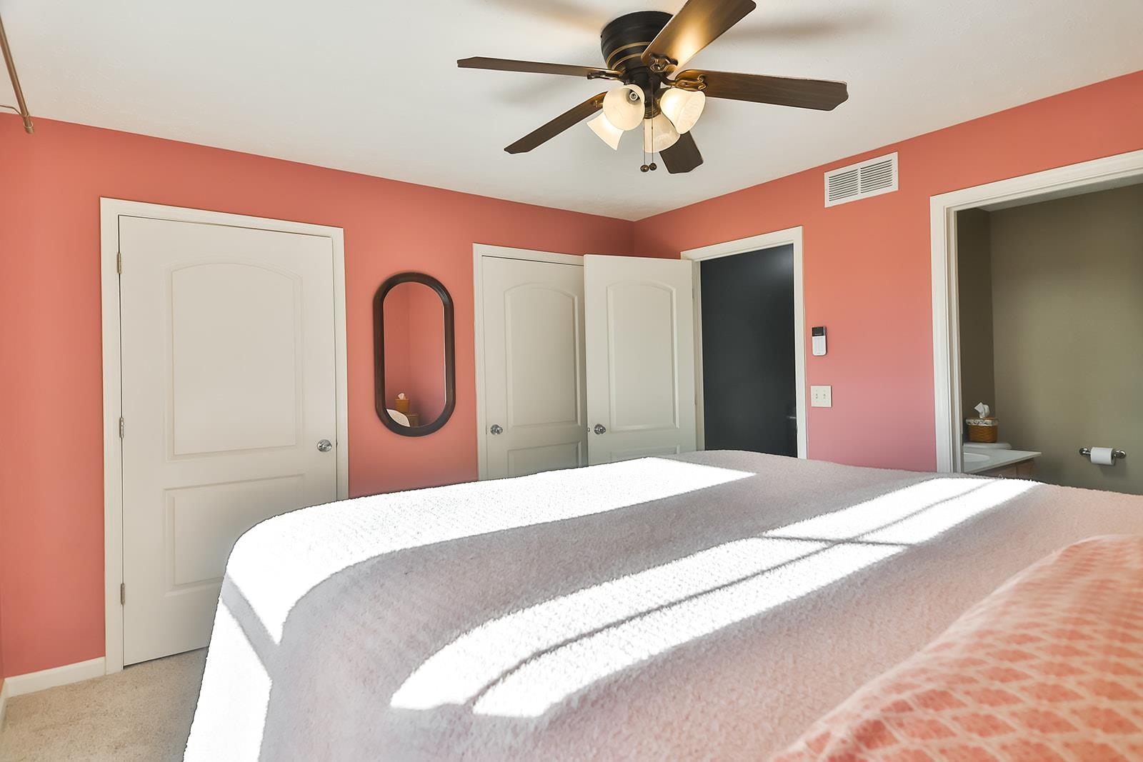 621 Grove Street Pecatonica, IL 61063 - Photo 11 of 26 a bedroom with a bed and a large mirror