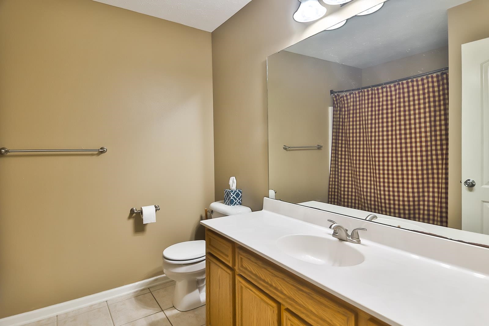 621 Grove Street Pecatonica, IL 61063 - Photo 12 of 26 a bathroom with a sink a toilet and mirror