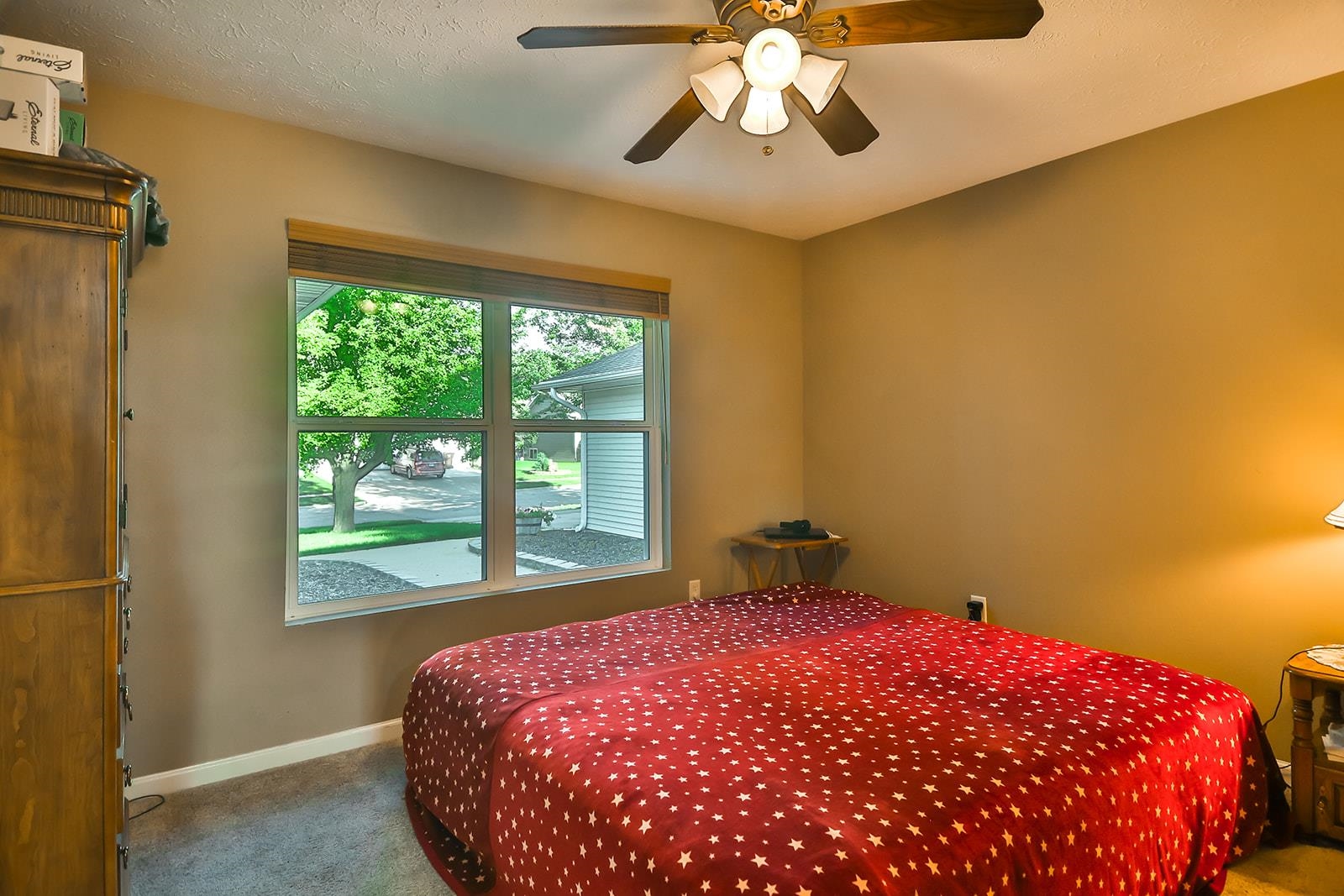 621 Grove Street Pecatonica, IL 61063 - Photo 13 of 26 a bedroom with a bed and a chandelier