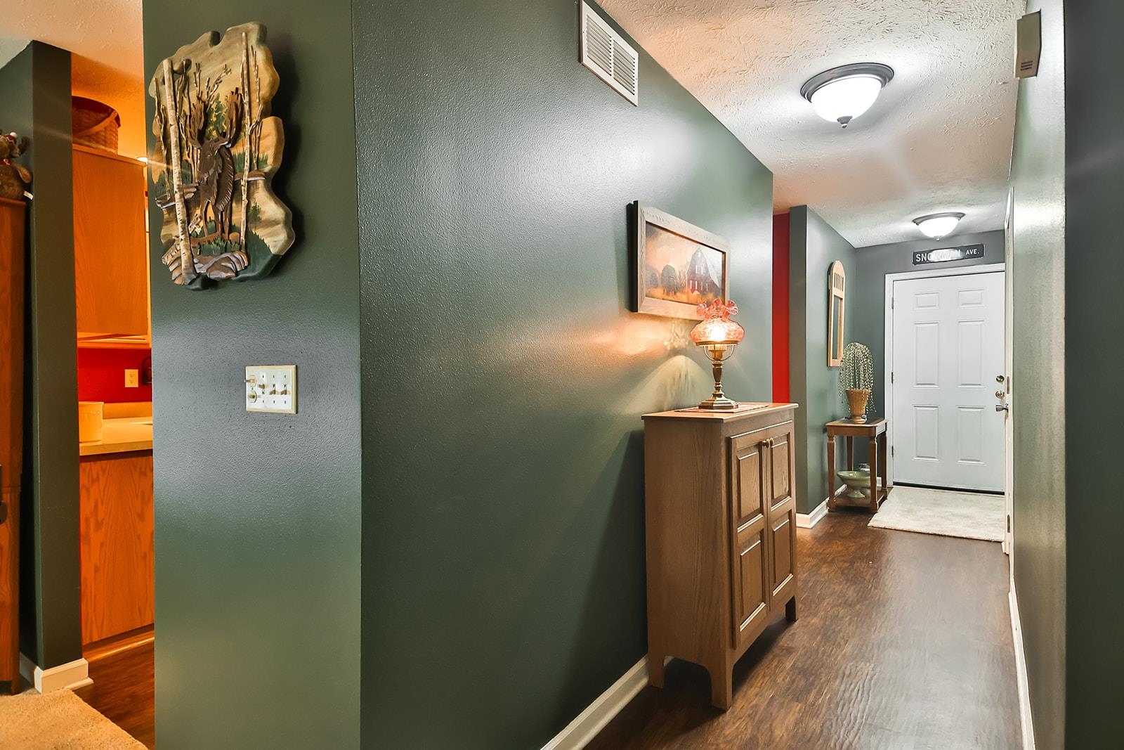 621 Grove Street Pecatonica, IL 61063 - Photo 20 of 26 a view of a hallway with paintings on the wall