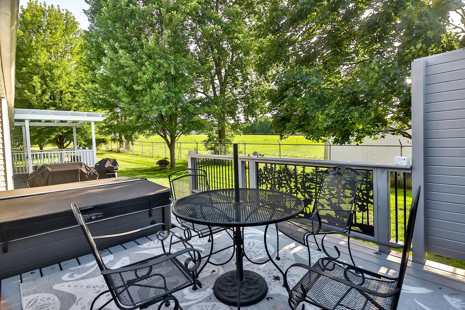 621 Grove Street Pecatonica, IL 61063 - Photo 5 of 26 a view of patio with table and chairs and potted plants