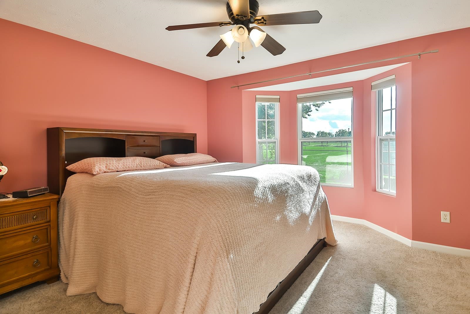 621 Grove Street Pecatonica, IL 61063 - Photo 9 of 26 a bed sitting in a spacious bedroom next to a window