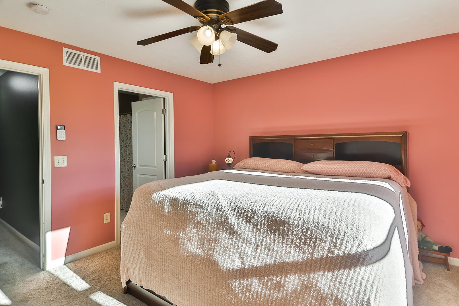 621 Grove Street Pecatonica, IL 61063 - Photo 10 of 26 a bedroom with a bed and a ceiling fan