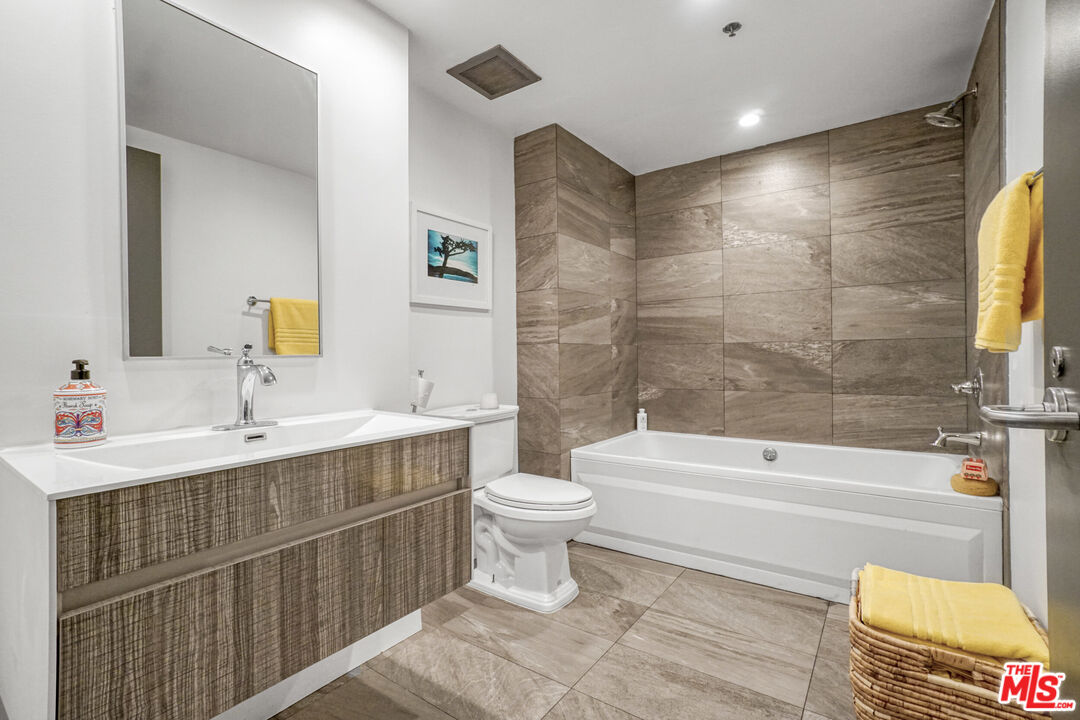 1855 Industrial Street, Unit 112 Los Angeles, CA 90021 - Photo 15 of 51 a bathroom with a sink a toilet and shower