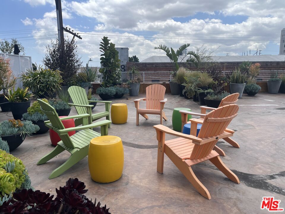 1855 Industrial Street, Unit 112 Los Angeles, CA 90021 - Photo 41 of 51 a view of a patio with couches chairs and a potted plant