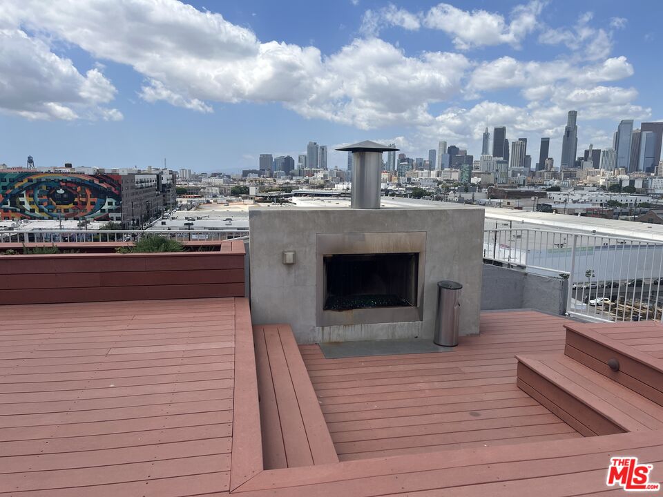 1855 Industrial Street, Unit 112 Los Angeles, CA 90021 - Photo 44 of 51 a terrace with kitchen view and wooden floor