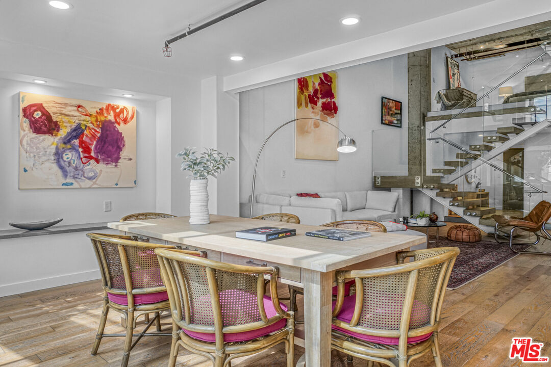 1855 Industrial Street, Unit 112 Los Angeles, CA 90021 - Photo 8 of 51 a dining room with furniture and wooden floor