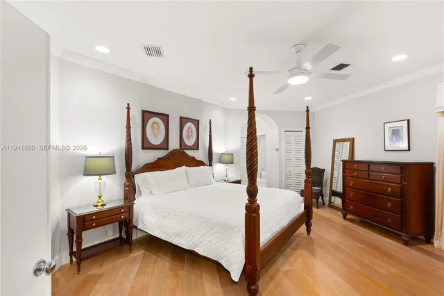 a bedroom with a bed and dresser