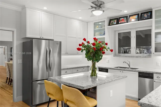 a kitchen with a stove and flowers