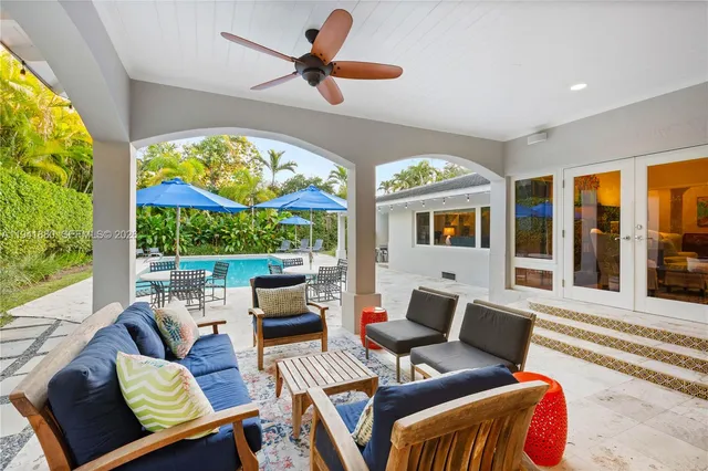 a patio with a yard table and chairs