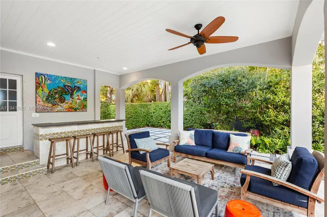 a patio with a patio table and chairs