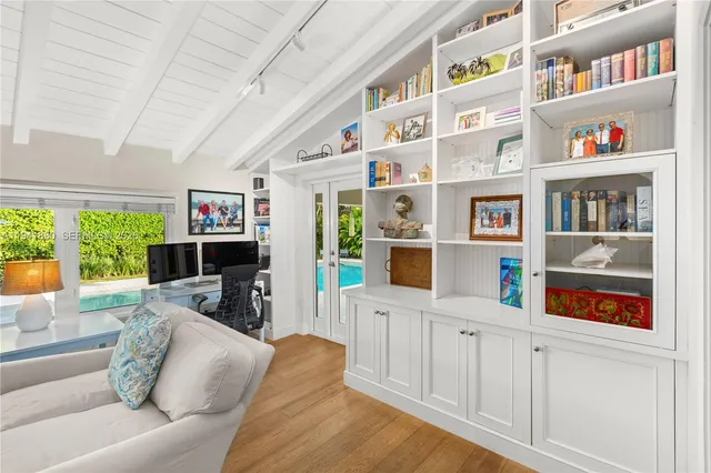a living room with furniture cabinets and a book shelf