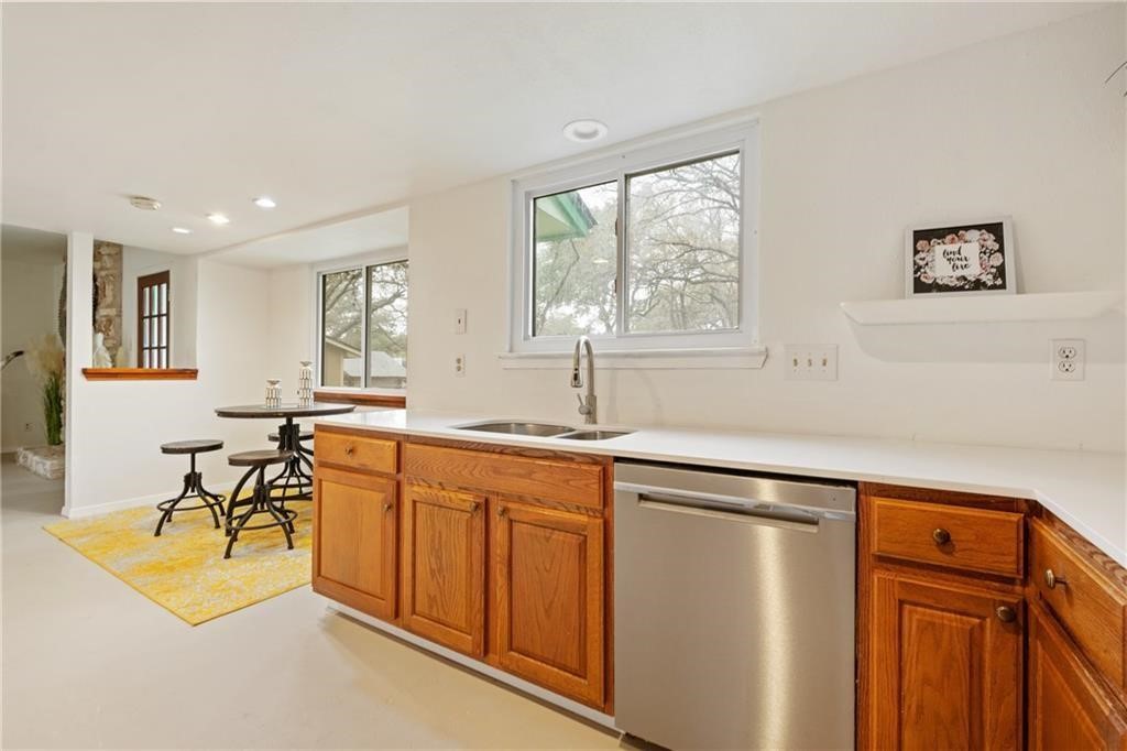 3318 Harpers Ferry Lane Austin, TX 78745 - Photo 15 of 24 a kitchen with stainless steel appliances granite countertop a sink and a refrigerator