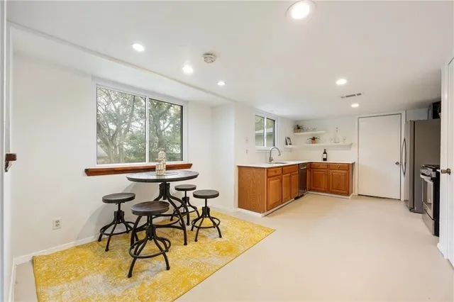 a view of a dining room with furniture window and outside view