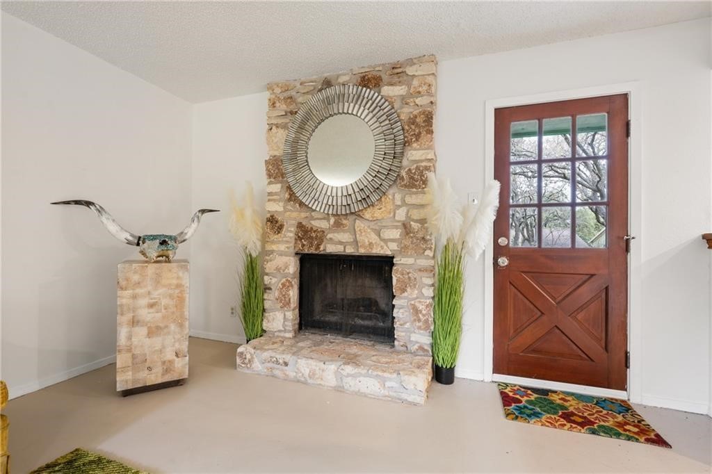 3318 Harpers Ferry Lane Austin, TX 78745 - Photo 18 of 24 a living room with furniture and a fireplace