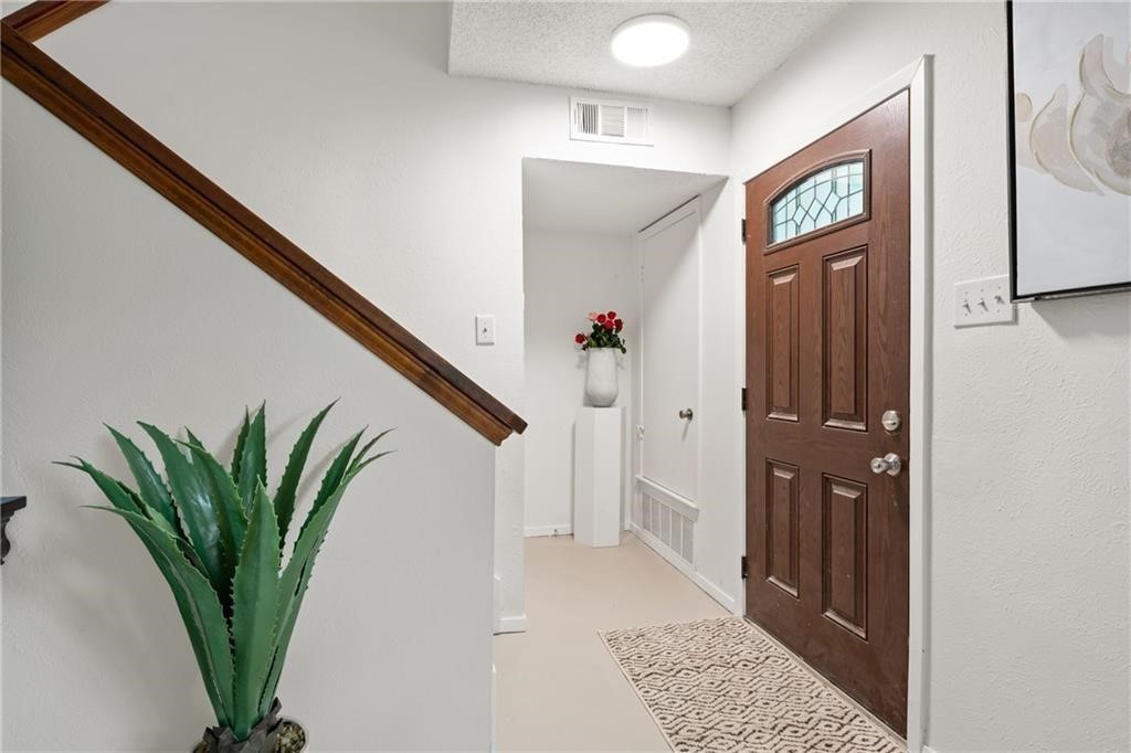 3318 Harpers Ferry Lane Austin, TX 78745 - Photo 19 of 24 a view of a hallway with a flower pot