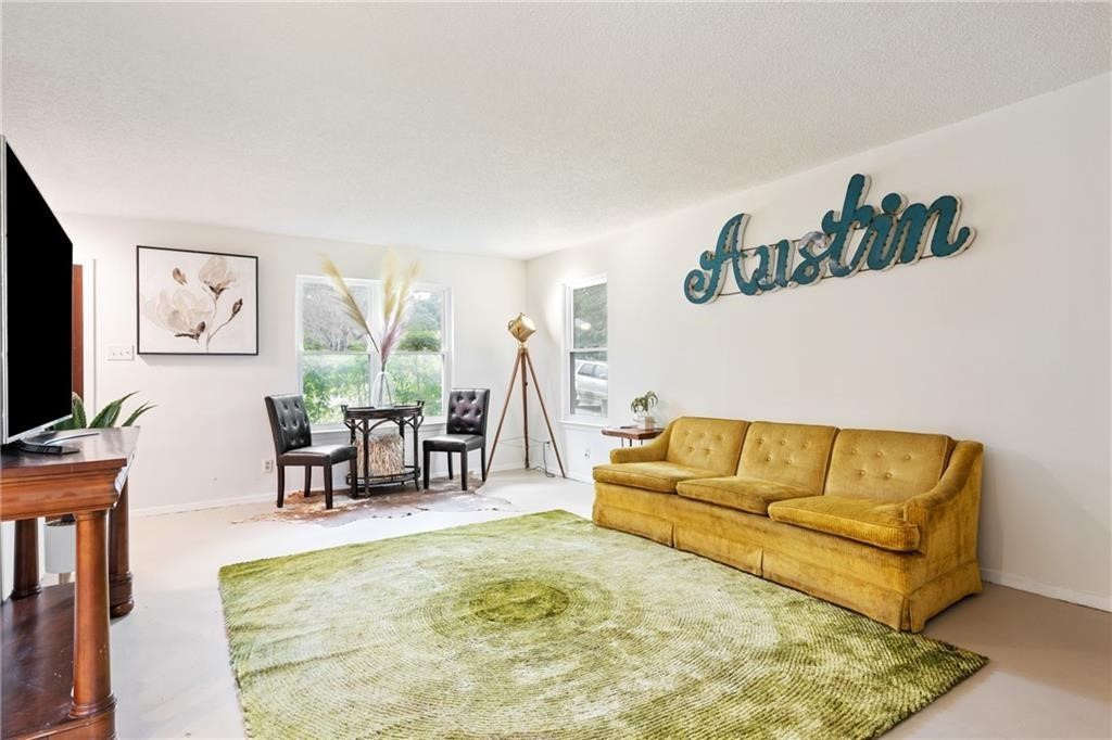 3318 Harpers Ferry Lane Austin, TX 78745 - Photo 20 of 24 a living room with furniture and a flat screen tv