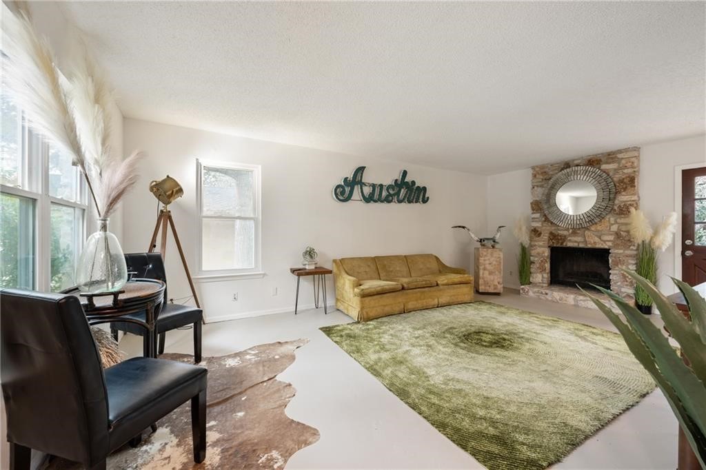 3318 Harpers Ferry Lane Austin, TX 78745 - Photo 21 of 24 a living room with furniture and a fireplace