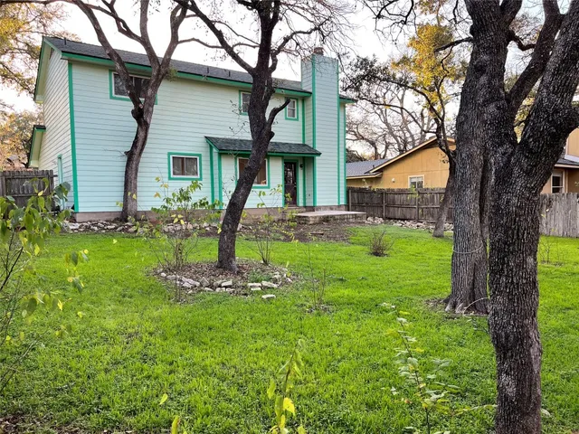 a backyard of a house with lots of green space