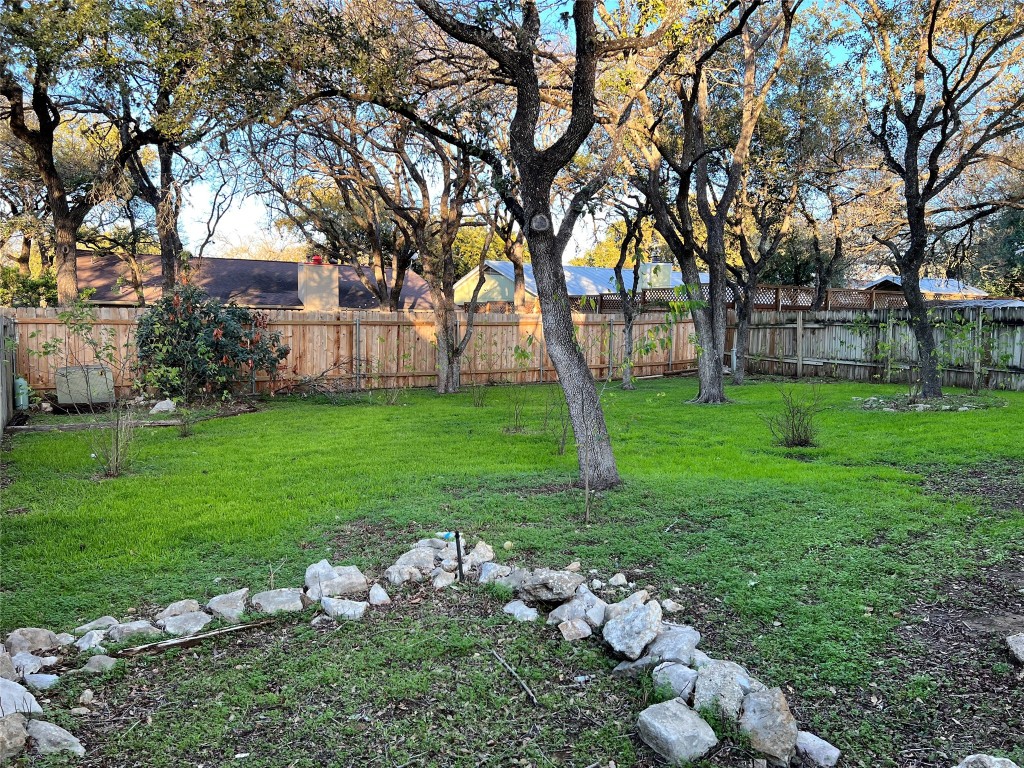 3318 Harpers Ferry Lane Austin, TX 78745 - Photo 24 of 24 a backyard of a house with lots of green space