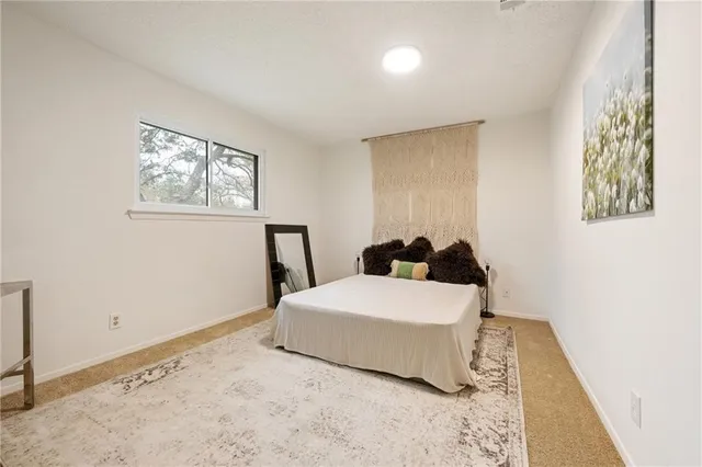 a room with a bed and a window