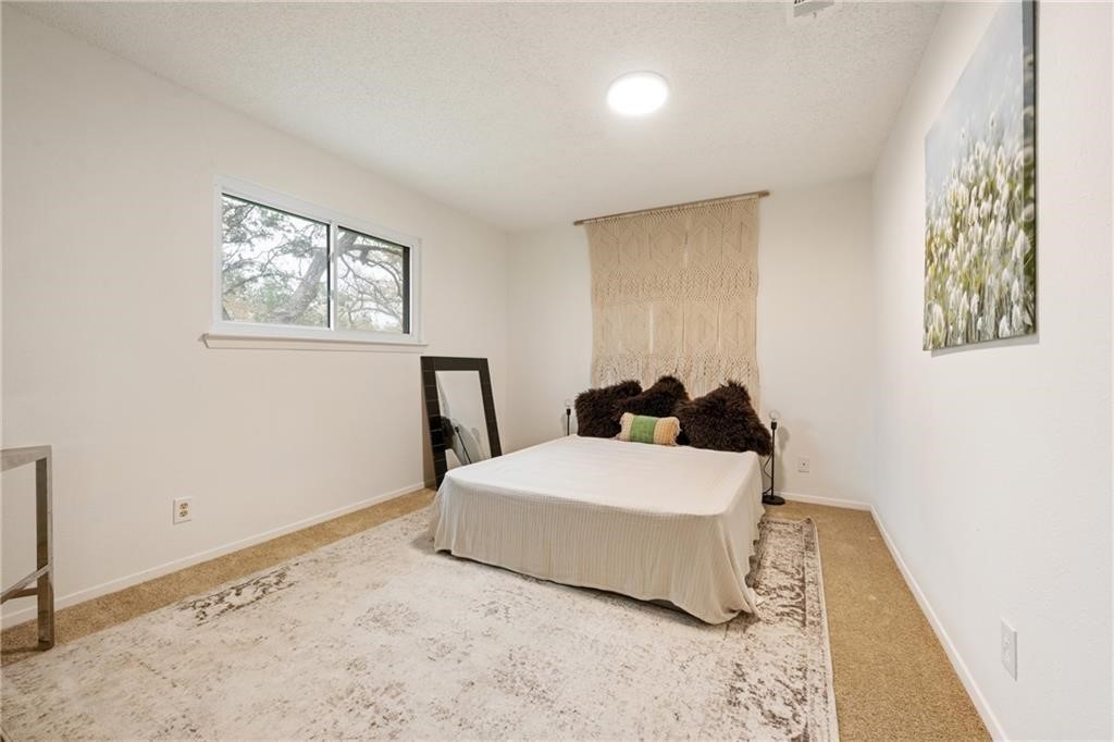 3318 Harpers Ferry Lane Austin, TX 78745 - Photo 5 of 24 a room with a bed and a window