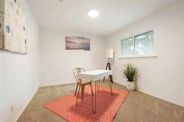 a workspace with furniture and window