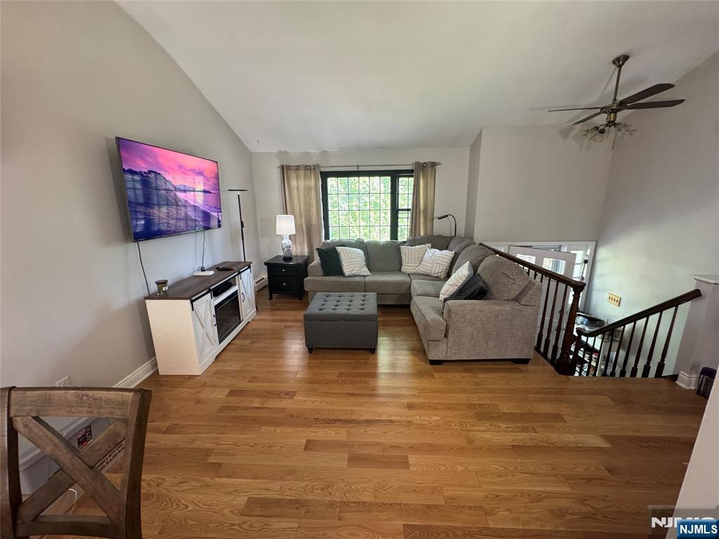55 Maryann Road Oak Ridge, NJ 07438 - Photo 4 of 20 a living room with furniture and a flat screen tv
