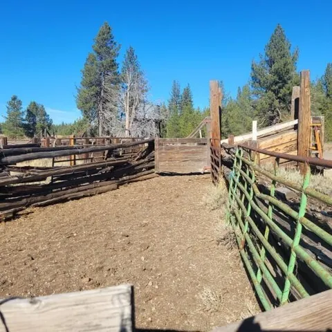 a view of a roof deck with couches and sky view