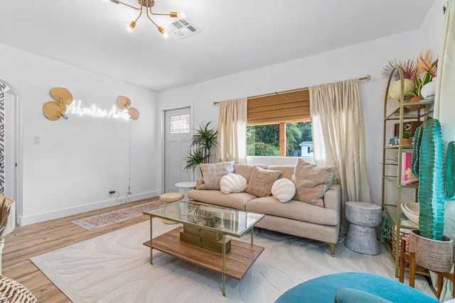 a living room with furniture and a window