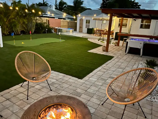 a view of a swimming pool and lounge chairs