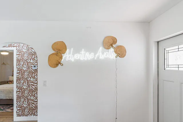 a front view of a house with garden and patio