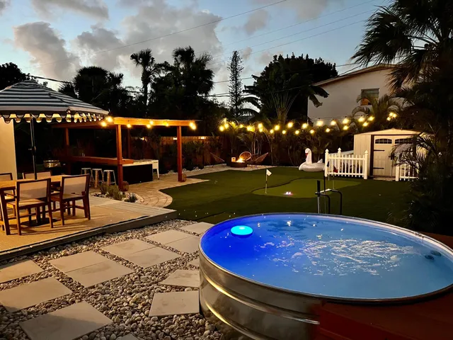 a view of a swimming pool with an outdoor space and seating area