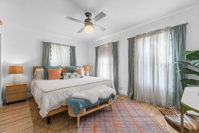 a bedroom with a bed and window