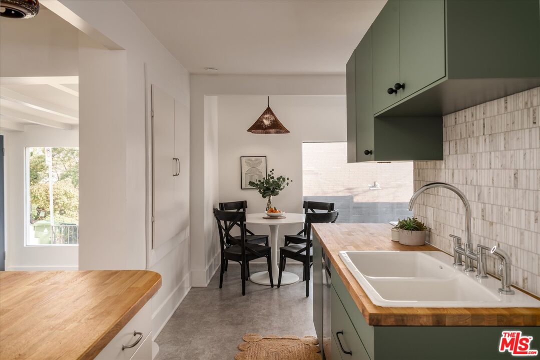 6036 Eucalyptus Lane Los Angeles, CA 90042 - Photo 12 of 34 a kitchen with granite countertop a sink and a stove