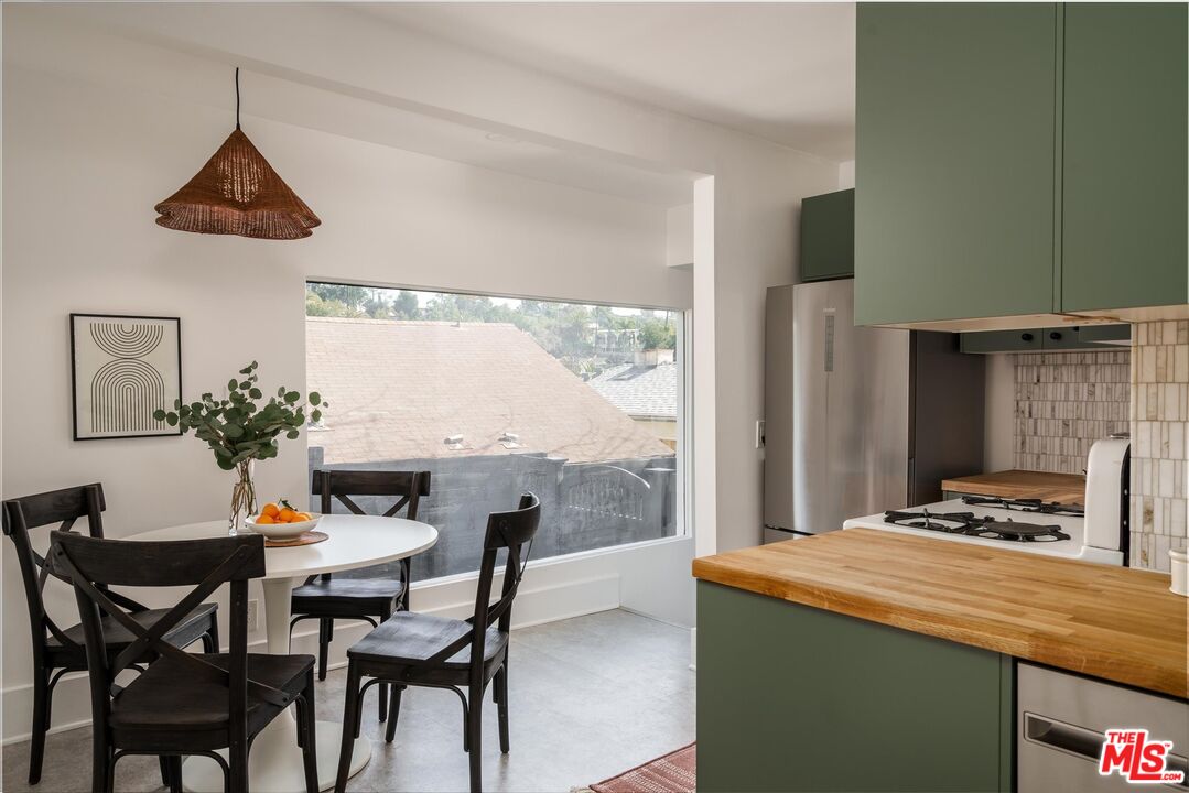 6036 Eucalyptus Lane Los Angeles, CA 90042 - Photo 13 of 34 a dining room with furniture and window