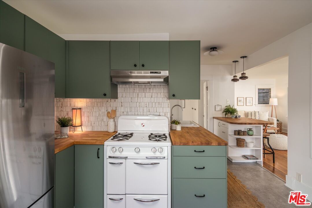 6036 Eucalyptus Lane Los Angeles, CA 90042 - Photo 14 of 34 a utility room with cabinets washer and dryer