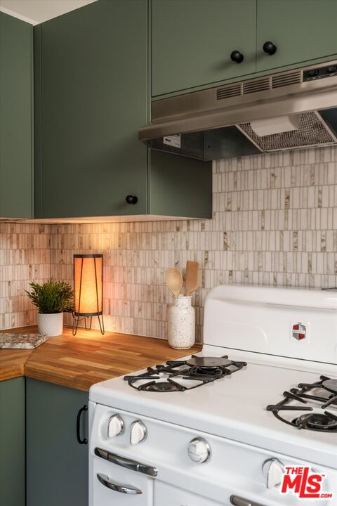 6036 Eucalyptus Lane Los Angeles, CA 90042 - Photo 15 of 34 a stove top oven sitting inside of a kitchen