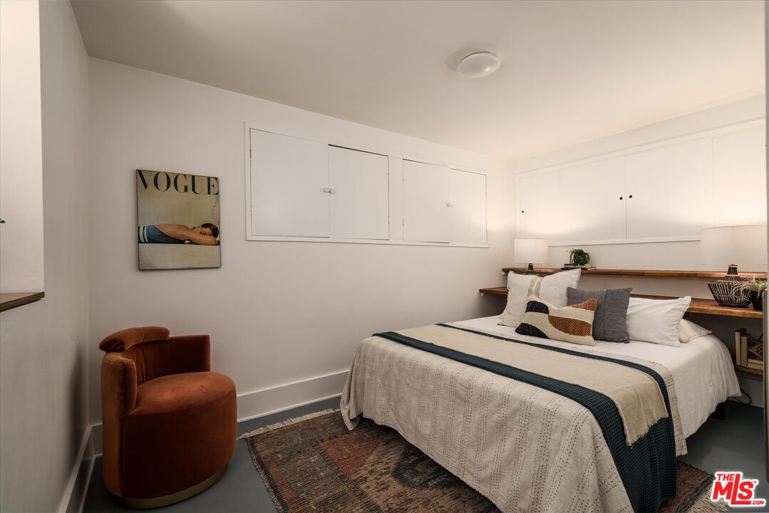 6036 Eucalyptus Lane Los Angeles, CA 90042 - Photo 24 of 34 a bedroom with two beds and painting on the wall